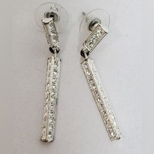 Silver jeweled triangular post earrings.